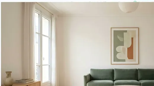 Bright living room with a green sofa, cover of the 2026 Barometer